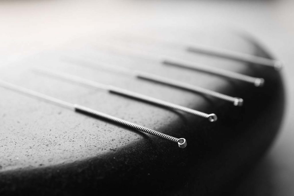 Stone And Needles For Acupuncture, Closeup
